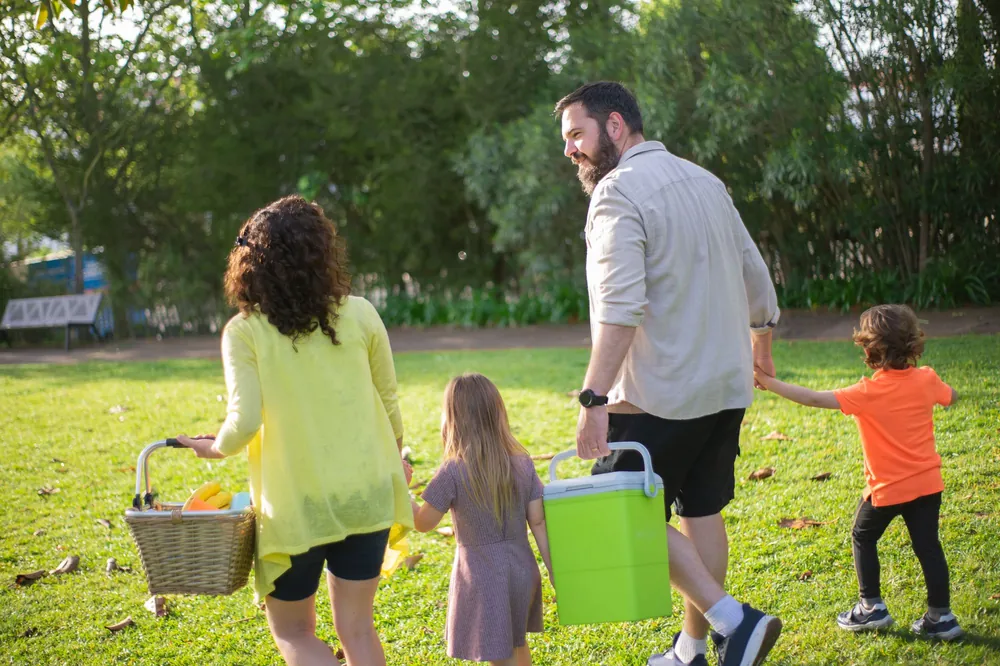 A family with two children having a picnic in a park