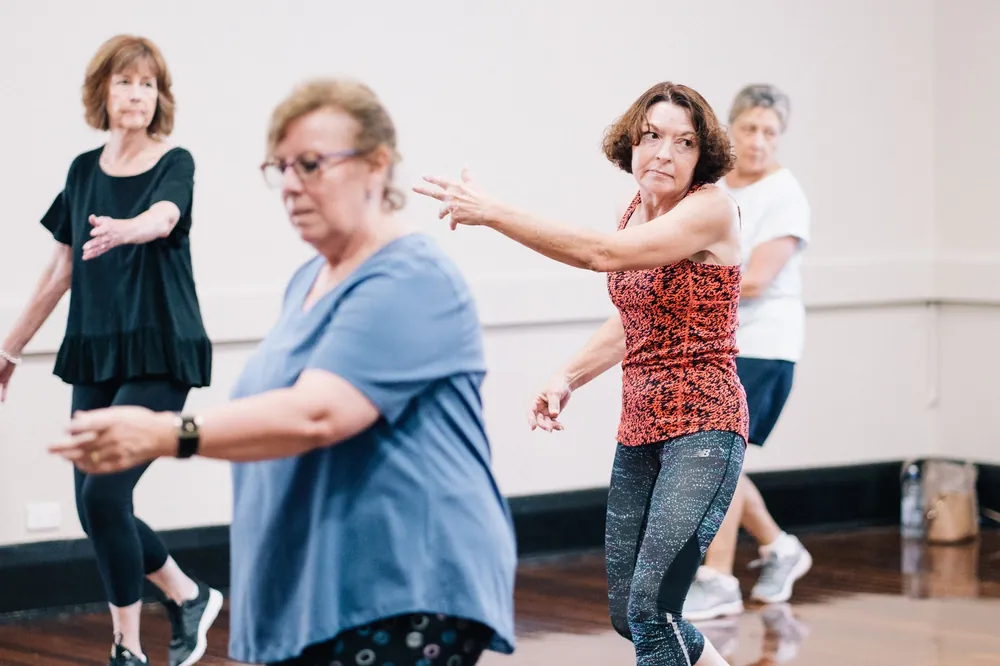 Adults dancing together at a group class