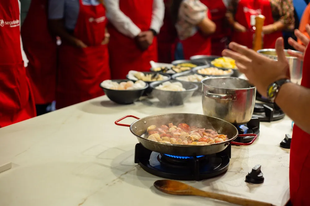 People preparing food together at a cooking class