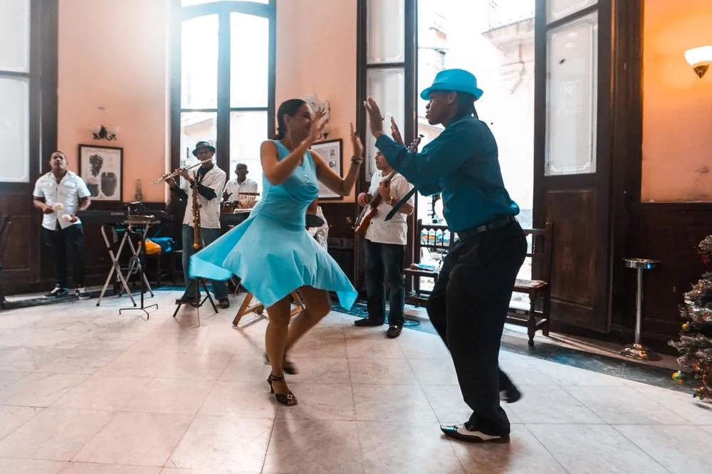 People dancing to live music in a café