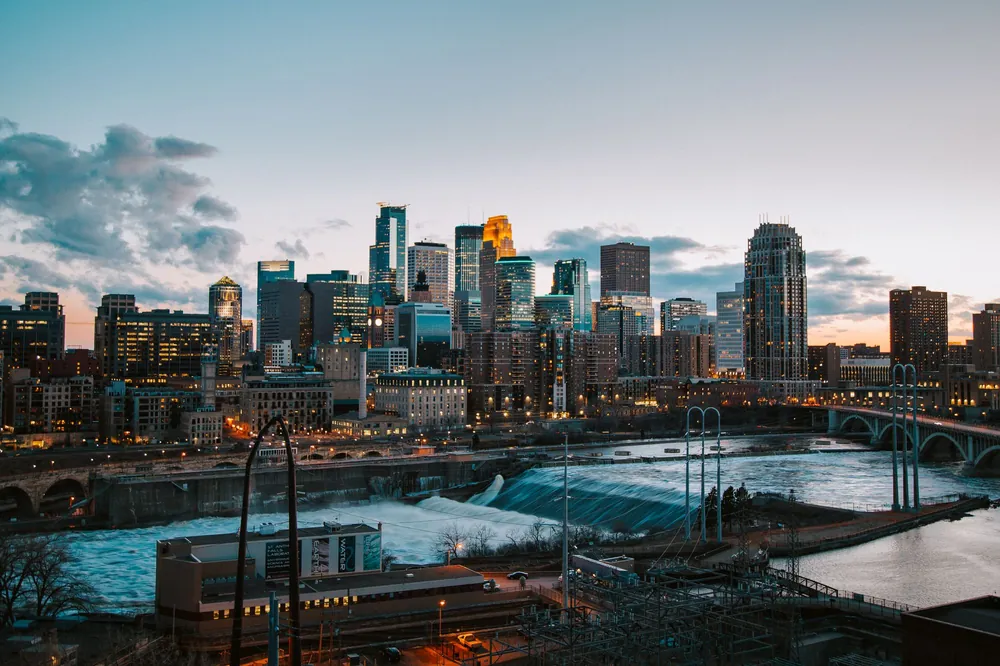 Minneapolis skyline and river at sunset, home city of LUMA Luxury Matchmaking